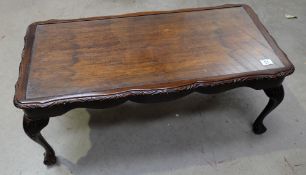 Mahogany oblong coffee table with glass top