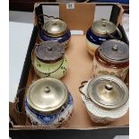 A collection of old biscuit barrels with silver plated mounts including Cresent Ware,