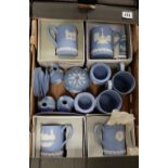 A Collection of Wedgwood jasper ware items including boxed commemorative mugs, vases, urn's,