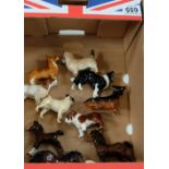 A collection of Beswick small dogs including Bulldog, sheepdog, setter, cairn, pug,dachshund,