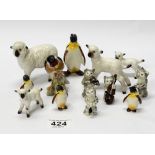 A collection of Beswick animals to include Penguin with Stick 803, 3 penguin chicks ,