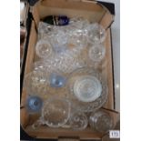 A large quantity of quality moulded and cut glassware to include drinking glasses, vases, jugs,