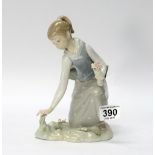 Lladro figure of girl with flowers