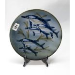 A Cobridge Stoneware plaque with dolphin design 28cm diameter