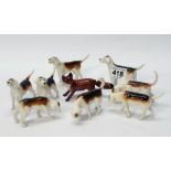 A Collection of Beswick Fox Hounds comprising models 941, 942, 944,
