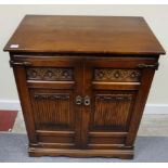 Carved oak linen fold two door TV cabinet