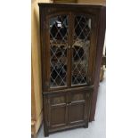 reproduction Carved oak corner cupboard with glazed doors