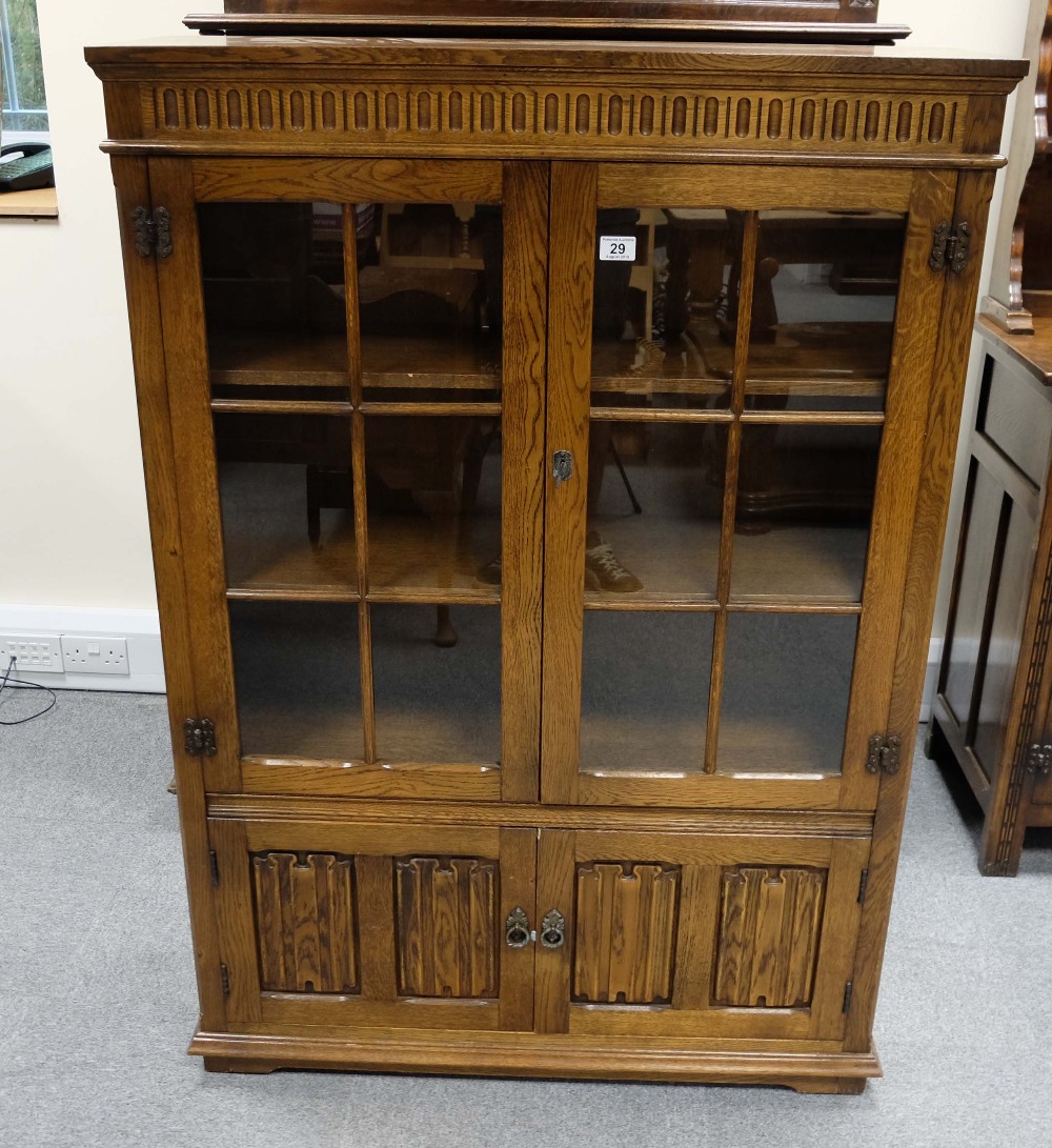 Reproduction Oak linen fold two door bookcase