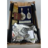 A collection of items to include silver plated dressing table set, cutlery set,