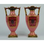 Pair Royal Crown Derby two handled vases decorated with gilt classical panels on salmon pink ground