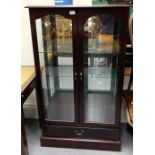 Modern glass fronted display cabinet