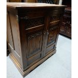 Carved oak linen fold two door TV cabinet