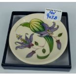 Moorcroft pin dish dated 2007 12cm diameter decorated with green and purple on cream ground