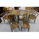 Oak drop leaf table and four matching wheel back chairs inc 2 carvers (5)