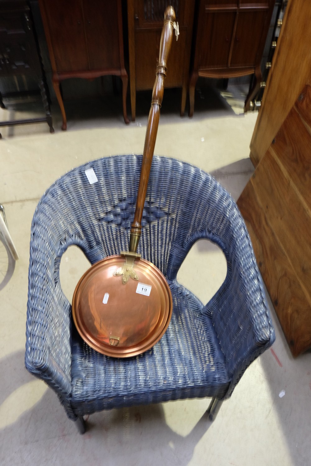 Blue lloyd loom armchair and brass bed warmer (2)