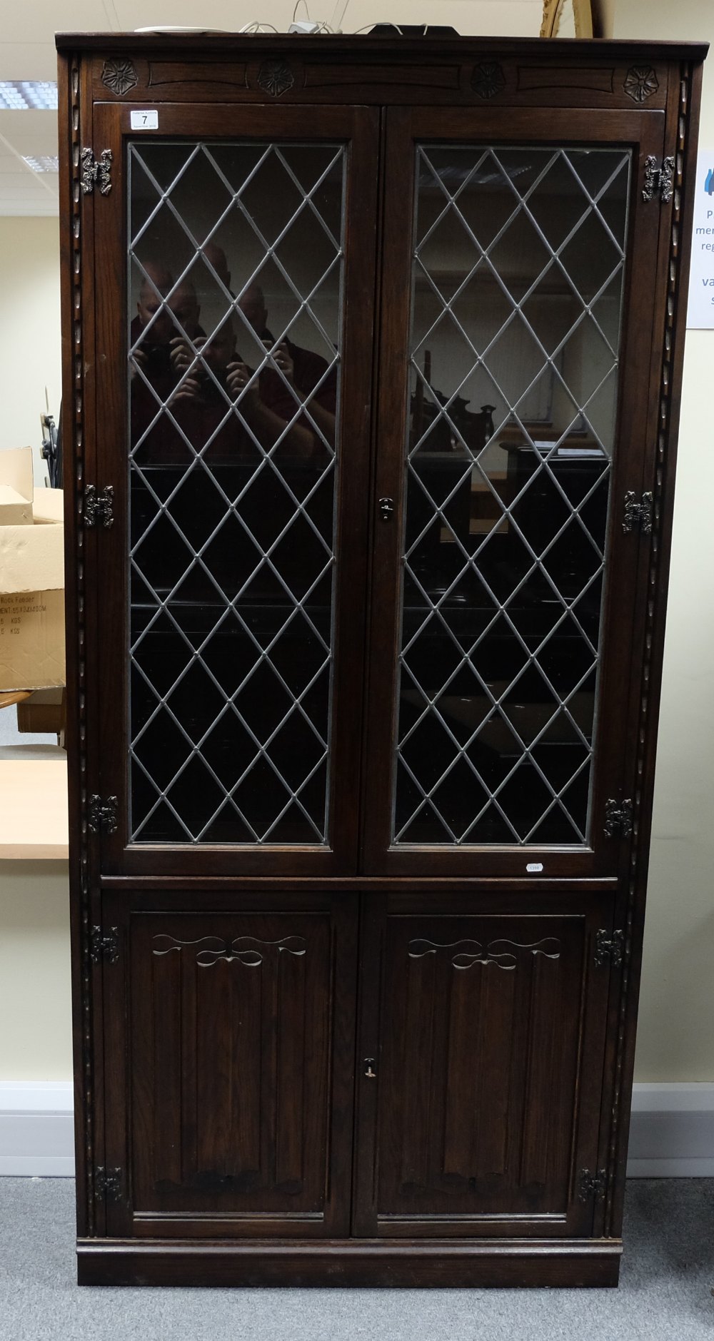 Reproduction large oak linen fold sectional bookcase comprising of four central doors with corner