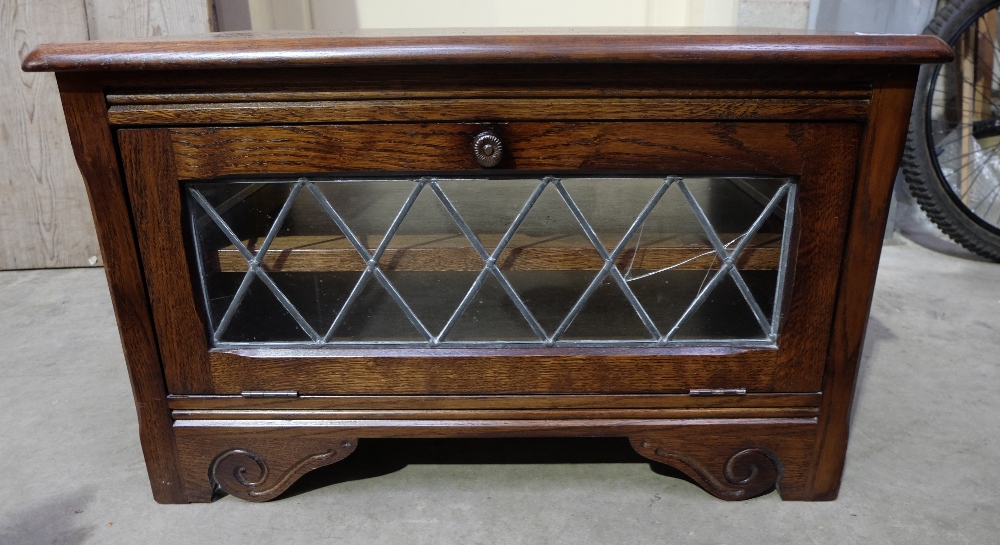 Oak glass fronted television cabinet