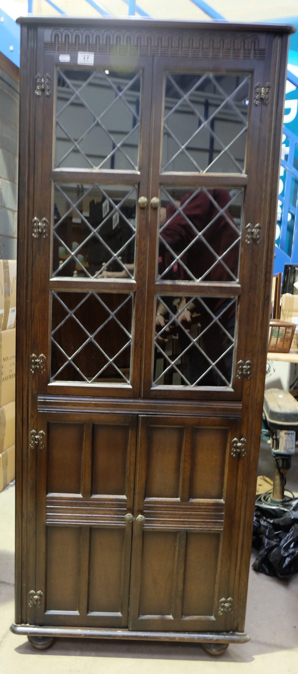 Oak glassed fronted corner unit in the priory style