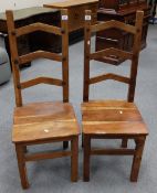Two Indonesian ladder back chairs (2)
