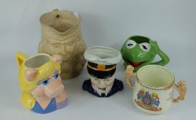 A collection of character jugs including