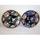 A pair of Maling peony-rose & butterfly pattern rack plates, with brightly glazed floral tube-