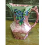 A Maling azalea-pattern jug of hexagonal form with scroll handle, decorated with tube-lined