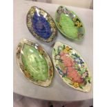 Four elliptical Maling entrée dishes decorated with pink, blue & green fishscale panels framed by