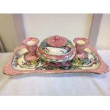 A Maling peony rose dressing table set with a powder bowl & cover, a pair of candlesticks and