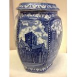 A Maling blue & white Ringtons hexagonal biscuit barrel and cover, decorated with architectural