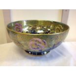 A gilded Maling Chelsea shaped bowl, decorated with polychrome flora on elaborate purple lustre