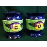 A pair of Maling Ringtons pansy flower vases, with pierced domed covers above hexagonal pots,