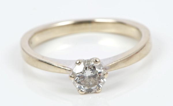 Diamond single stone ring with a brilliant cut diamond estimated to weigh approximately 0.40