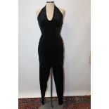 Ladies' 1980s vintage black halterneck velvet jumpsuit with apron front by Bodymap - British
