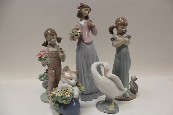 Three Lladro figures - girl with flowers, girl with kittens and girl with bird, Lladro goose and