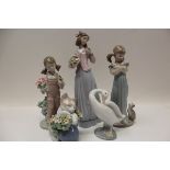 Three Lladro figures - girl with flowers, girl with kittens and girl with bird, Lladro goose and