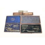 Two cased sets of drawing instruments and a pocket guinea balance by Stephen Houghton & Son (3)