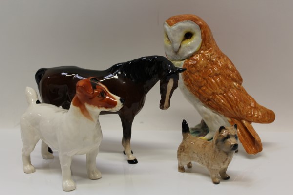 Beswick model of an owl, model no. 1046, Beswick horse and two Beswick dogs (4) CONDITION REPORT All