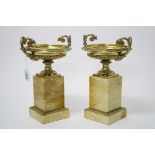 Pair contemporary gilt metal pedestal urns with foliate handles and egg and dart borders,