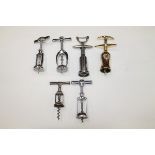 Six frame corkscrews including one marked 'Monopol'