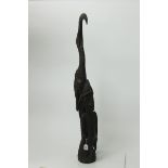 African carved wood fertility figure of a woman and a bird,