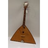 Six-string balalaika with faceted sound box