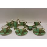 Art Deco Royal Doulton green and gilt part coffee set (14 pieces) CONDITION REPORT Sugar bowl has