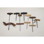 Eleven T-pull corkscrews including one with grapevine handle