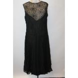 Ladies' circa 1940s vintage cocktail dress in fine black crepe with black lace panels,