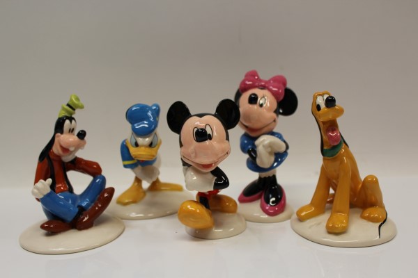 Five Royal Doulton The Mickey Mouse Collection figures - Donald Duck, Mickey Mouse, Goofy, Minnie