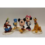 Five Royal Doulton The Mickey Mouse Collection figures - Donald Duck, Mickey Mouse, Goofy, Minnie