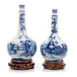 Pair of late 19th / early 20th century Chinese blue and white bottle vases with waisted necks,