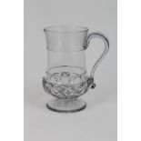 Georgian glass baluster-shaped mug with trailed and moulded decoration, the base inset with a George