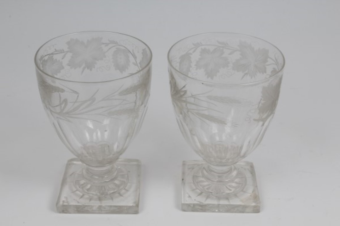 Pair of Victorian slice cut rummers with engraved vine and hop decoration on knopped stem on square