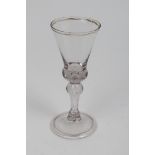 Georgian wine glass with tapered bowl and gilded rim with air bubble,